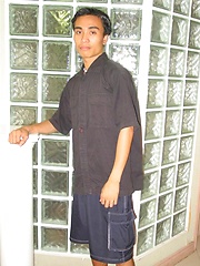 Cute asian boy posing and stripping