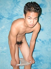 Shy asian stud posing before camera