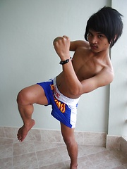 16 photos of cute gay Thai kickboxer posing and stripping